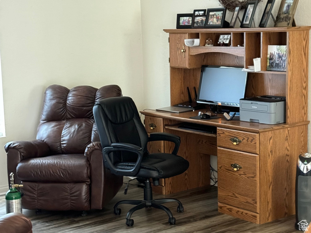 Home office with wood finished floors