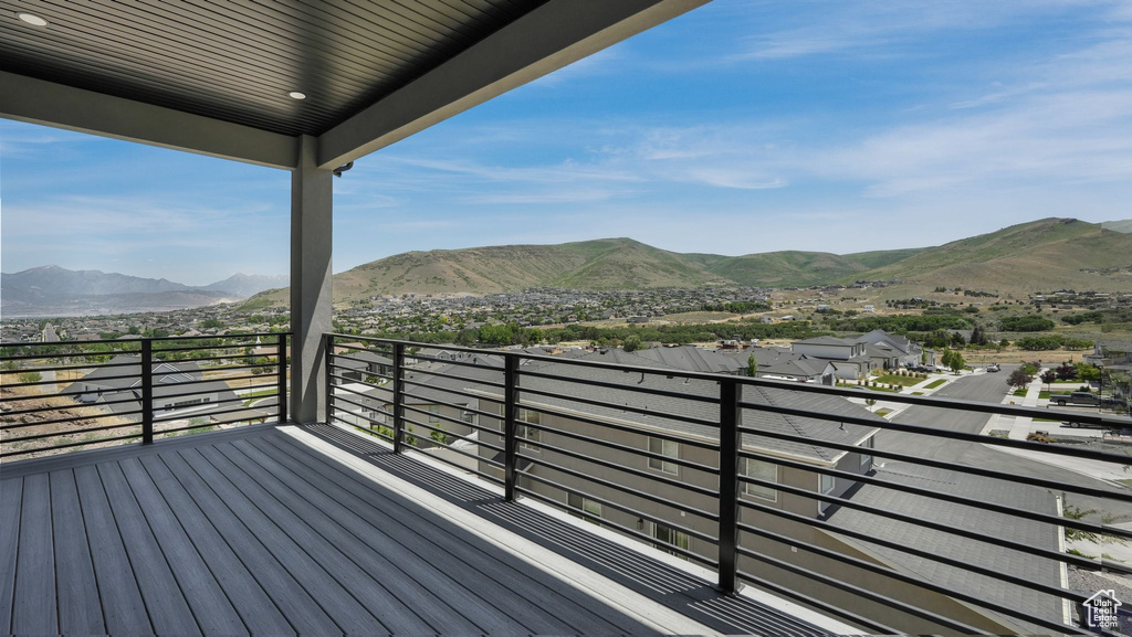 Wooden terrace featuring a mountain view