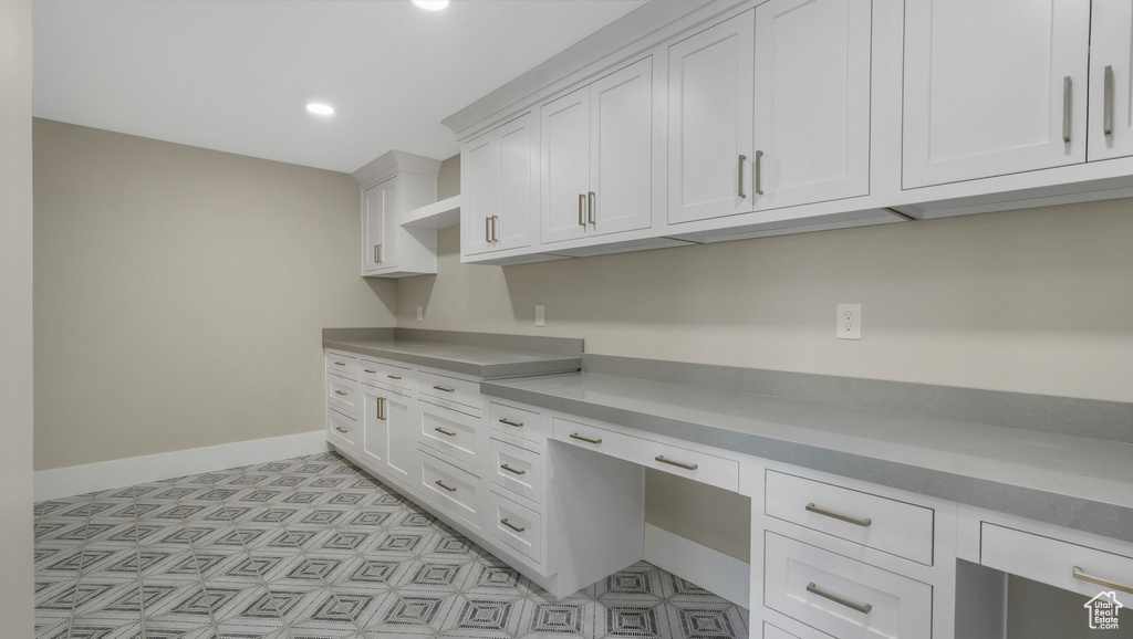 Unfurnished office featuring recessed lighting and light floors