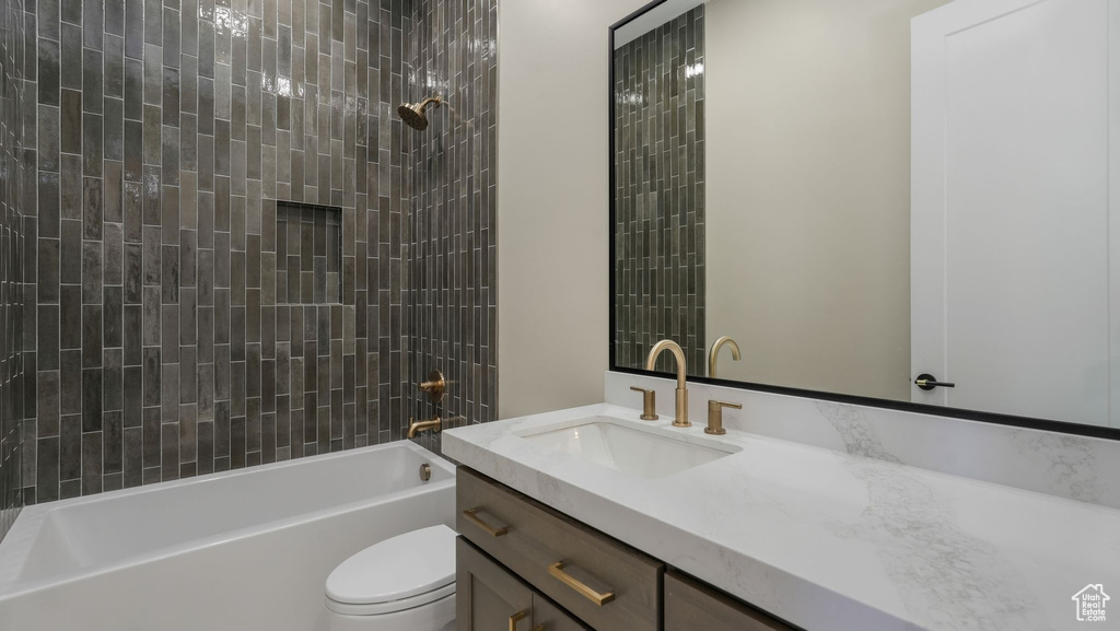 Full bath featuring vanity and shower / tub combination