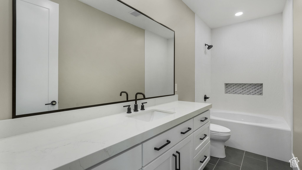 Bathroom with vanity, shower / bathtub combination, tile patterned flooring, and recessed lighting