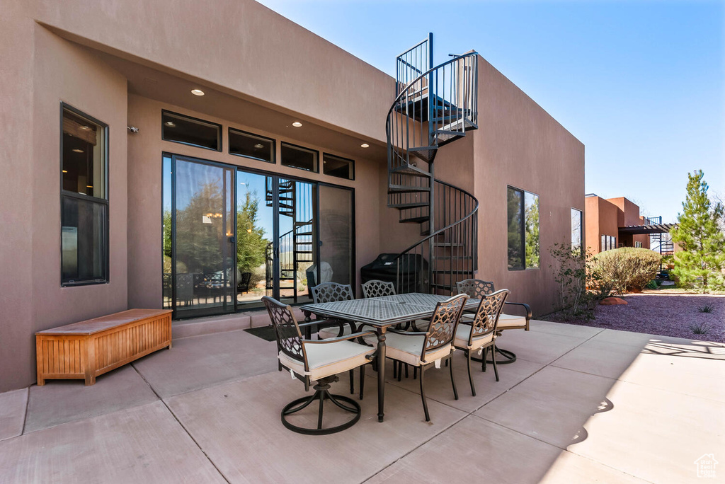 View of patio / terrace featuring stairs and outdoor dining area