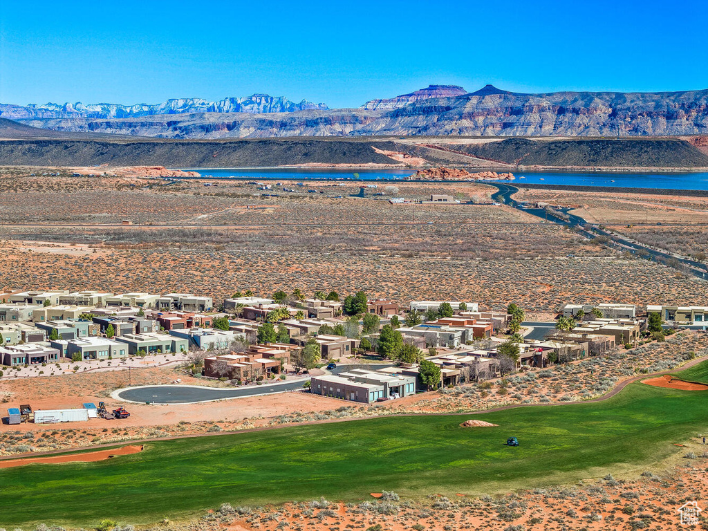 Aerial view of a water and mountain view and a golf course