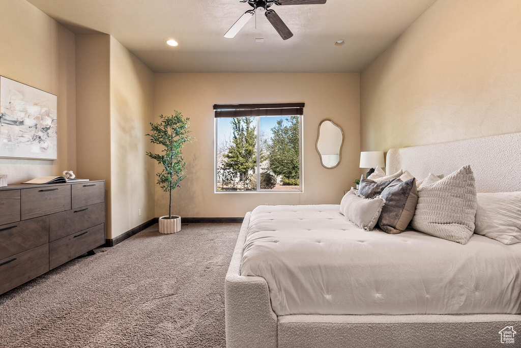 Bedroom featuring carpet, ceiling fan, and recessed lighting