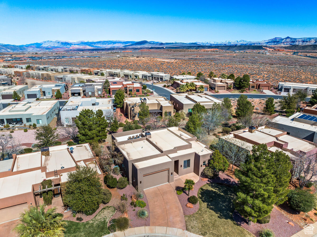 Aerial view of residential area featuring mountains