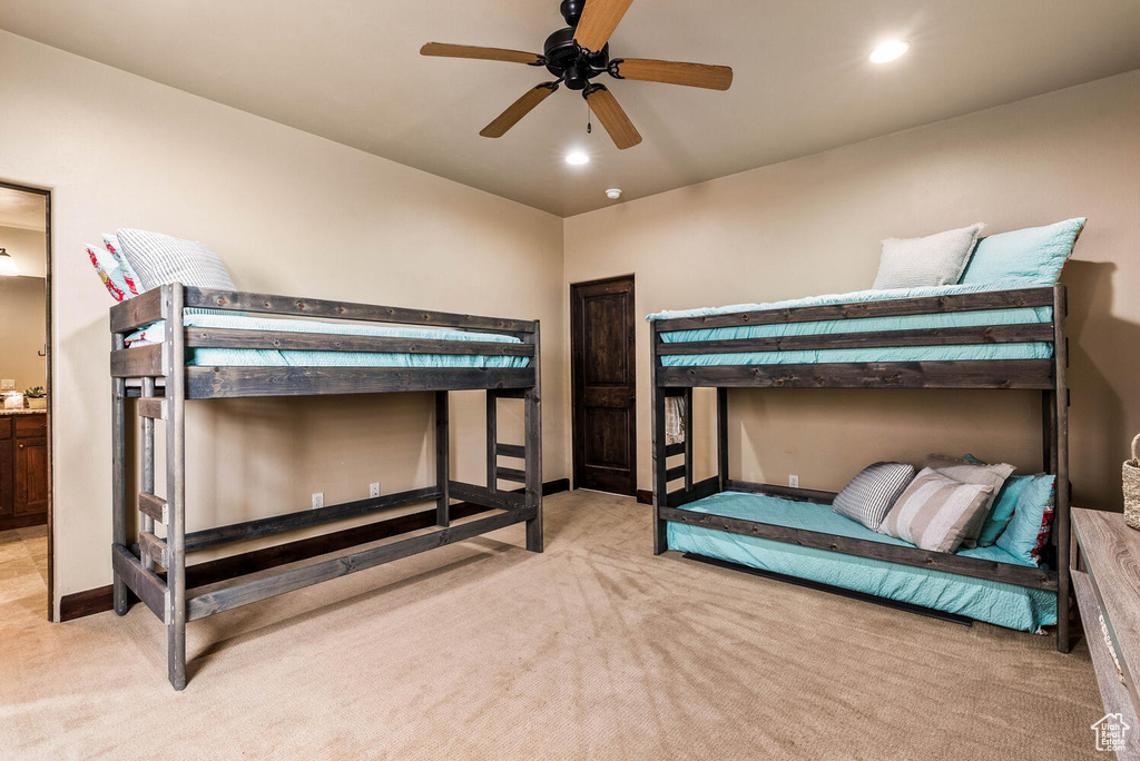 Bedroom with light carpet, recessed lighting, and ceiling fan