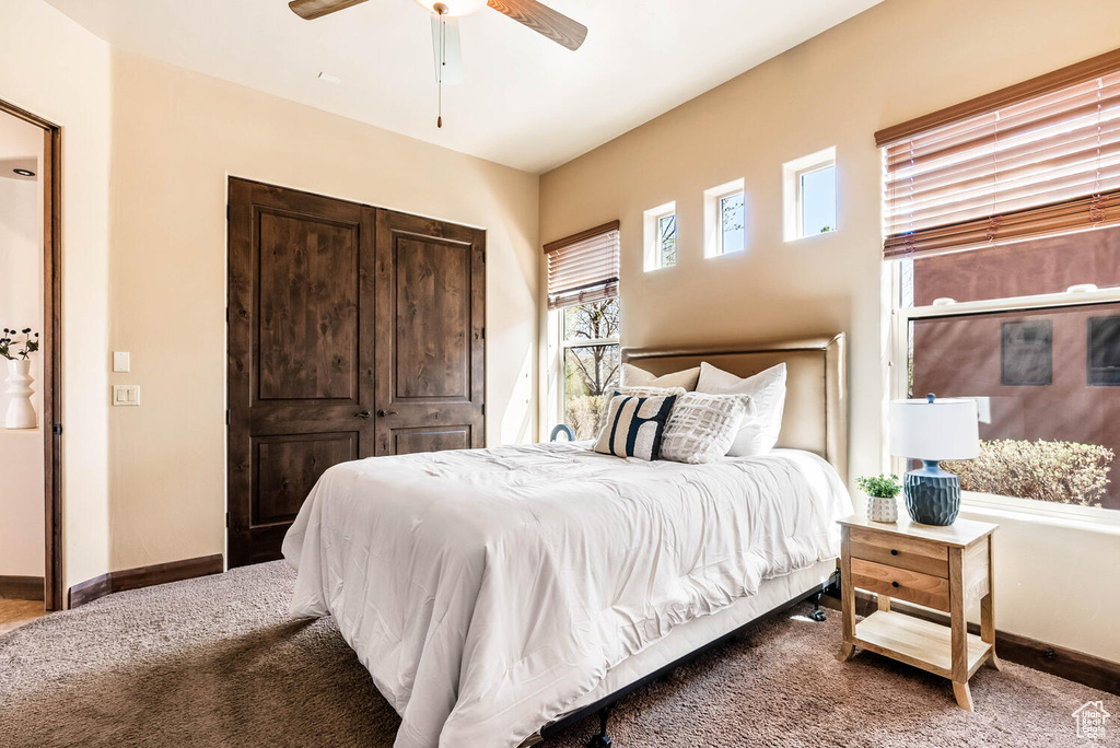 Bedroom with carpet and a ceiling fan