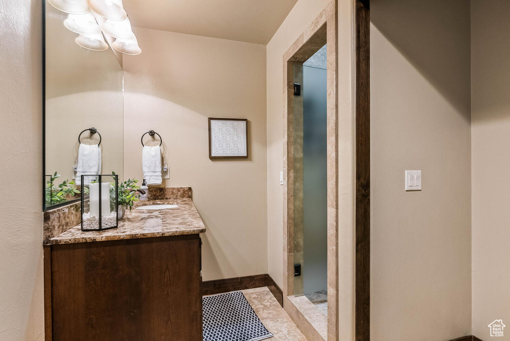 Full bathroom featuring vanity and a shower