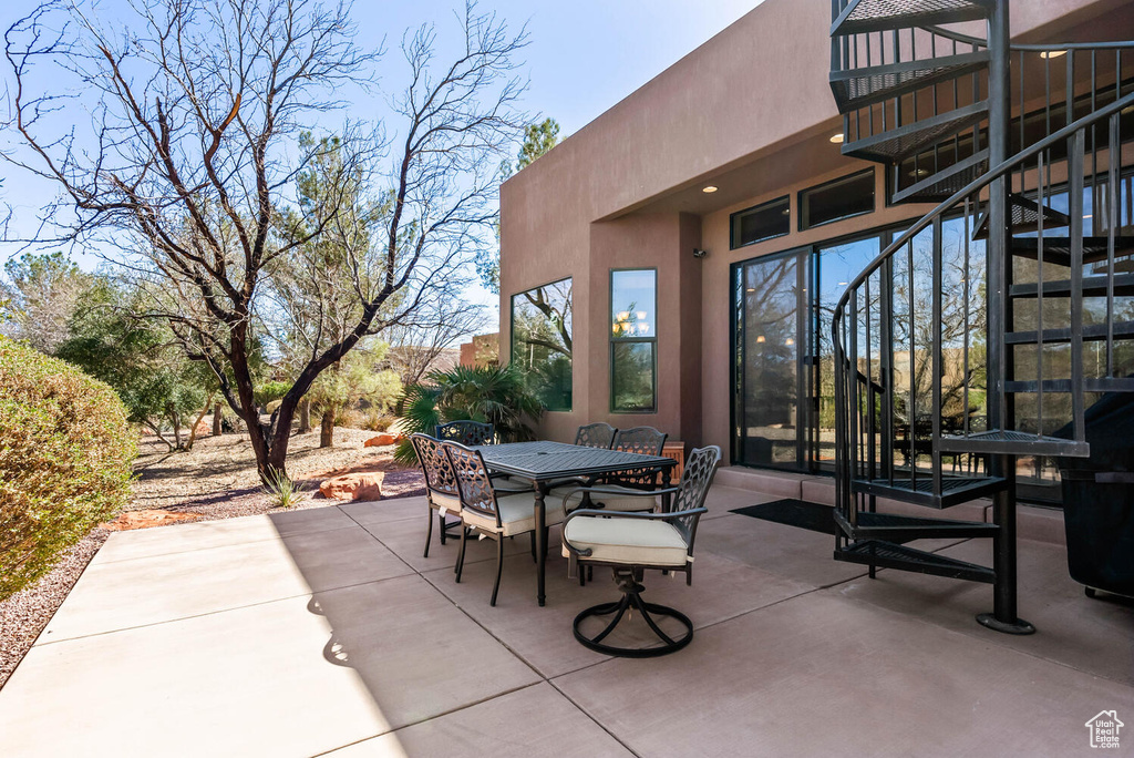 View of patio / terrace featuring stairs and outdoor dining space