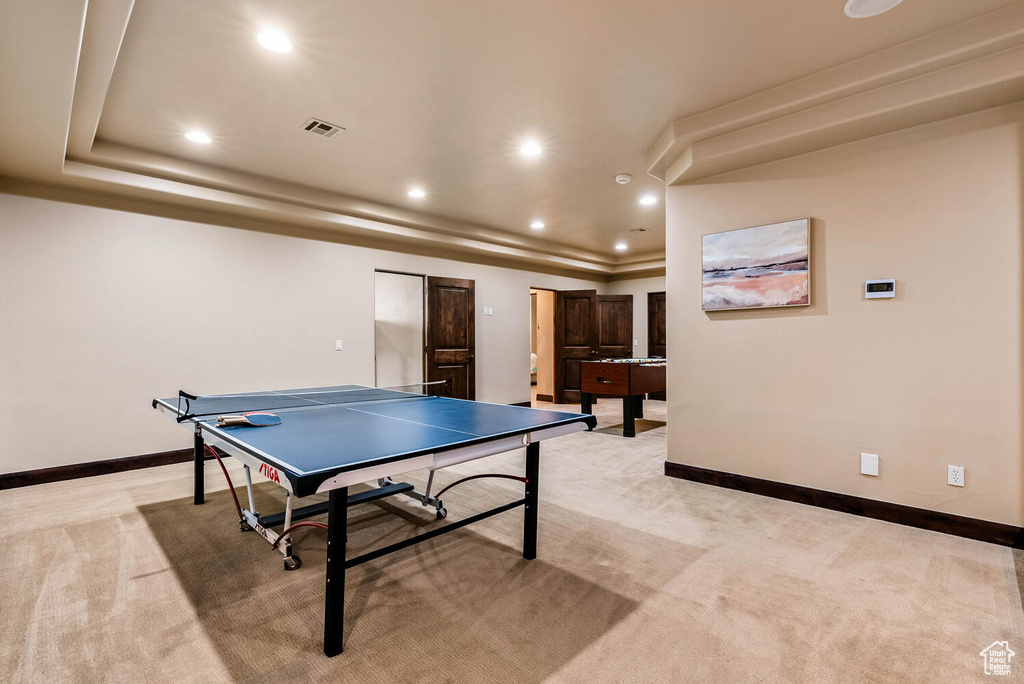 Game room with light colored carpet and recessed lighting