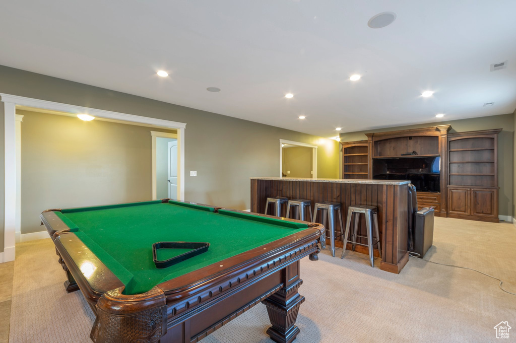 Game room featuring bar, light colored carpet, recessed lighting, and pool table