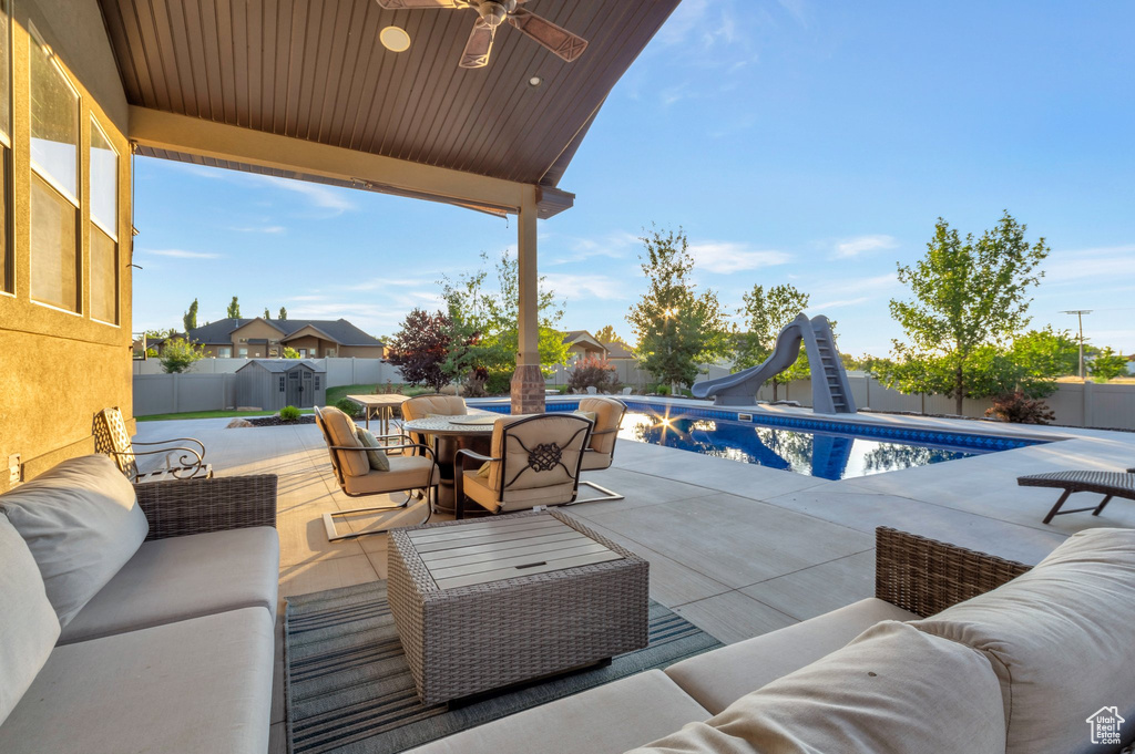 Fenced backyard with an outdoor living space, outdoor dining space, and a patio