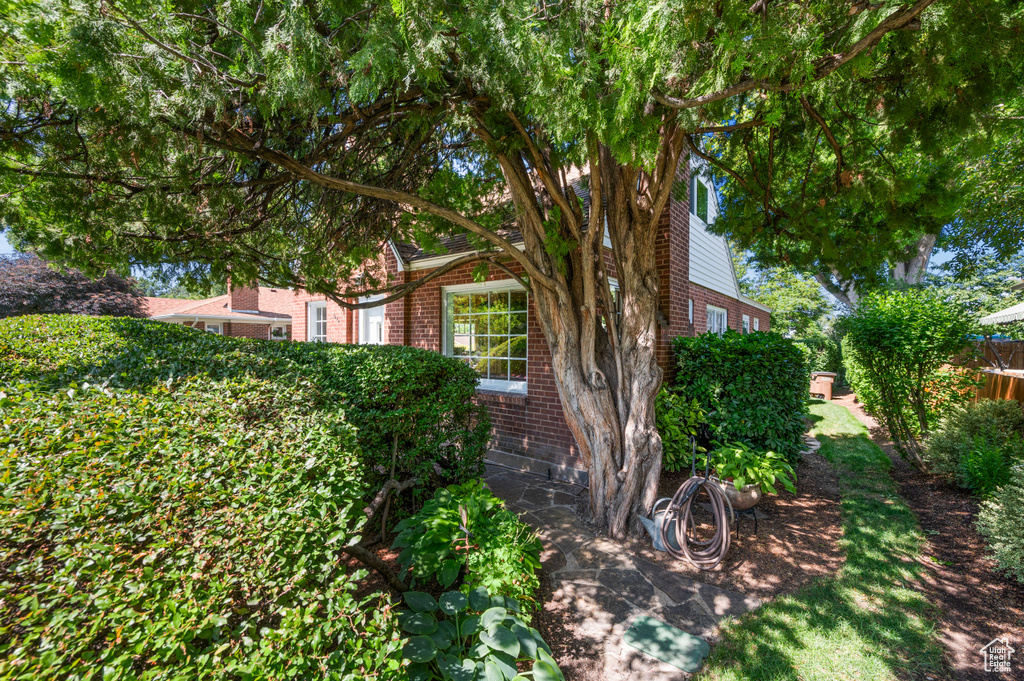 View of side of home with brick siding