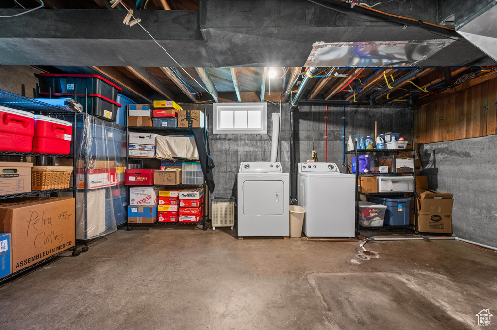 Basement featuring washer and clothes dryer