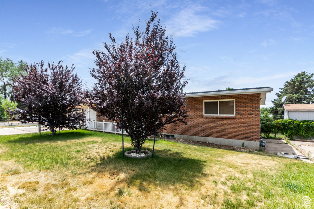 View of front of property with brick siding