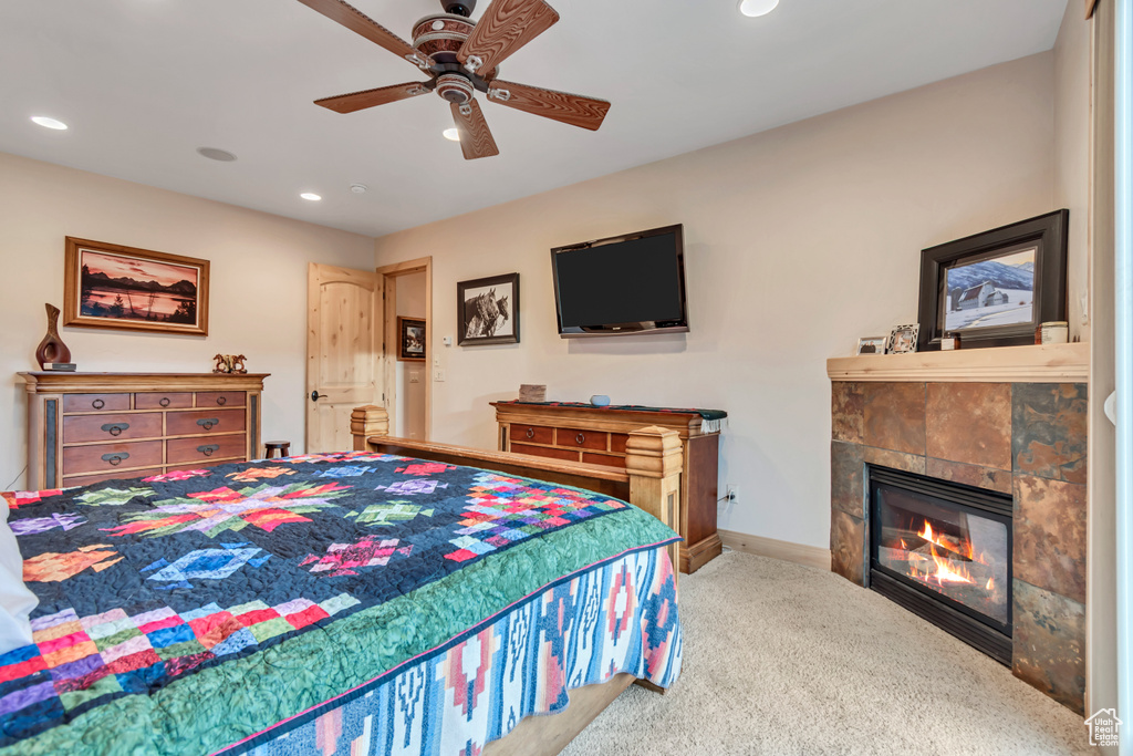 Bedroom featuring recessed lighting, carpet, a fireplace, and ceiling fan