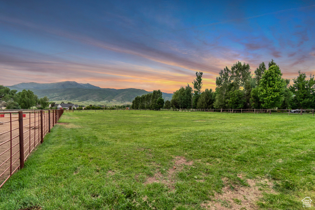 View of yard featuring a view of countryside and a mountain view
