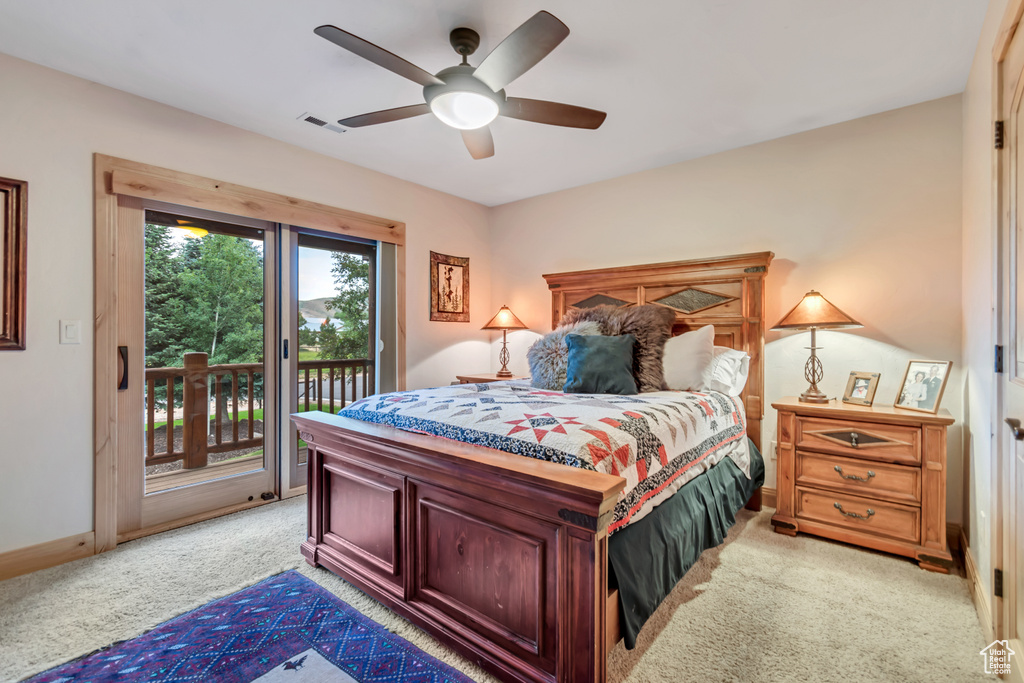 Bedroom featuring light carpet, access to outside, and a ceiling fan