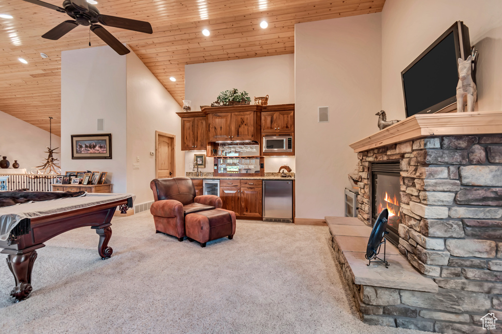 Living area with light colored carpet, wooden ceiling, high vaulted ceiling, ceiling fan, and billiards