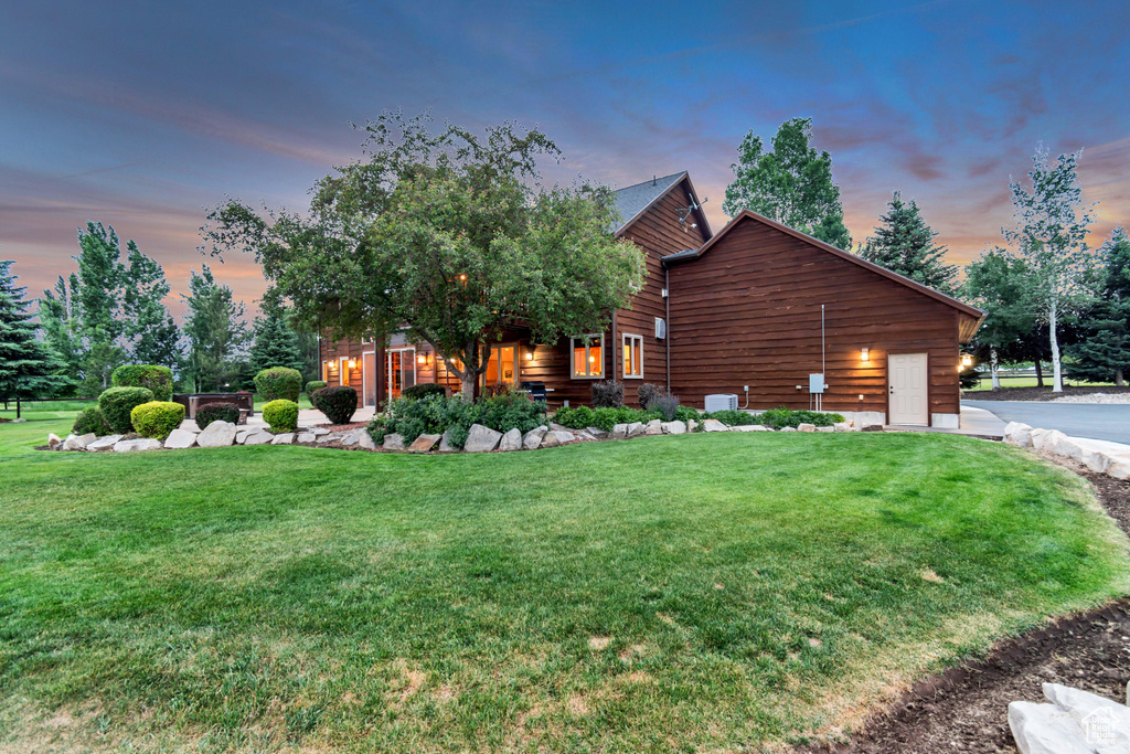 View of front of house with a front yard