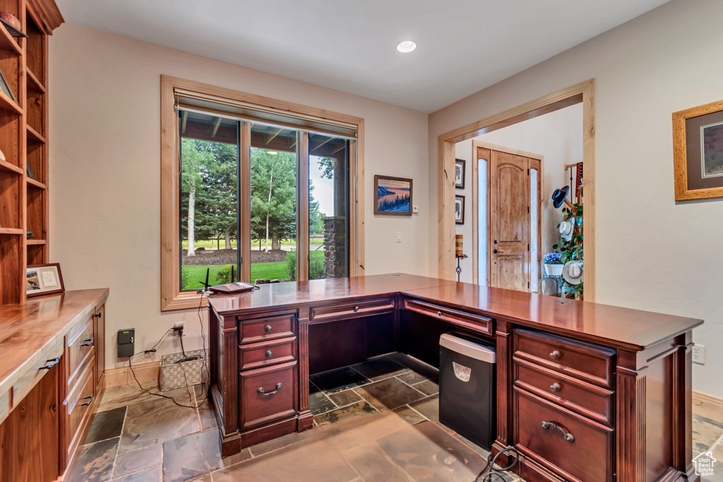 Office area with stone tile flooring and recessed lighting