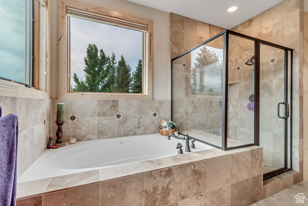 Full bath featuring a garden tub, a shower stall, and recessed lighting