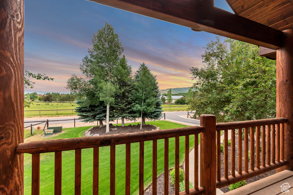 Deck featuring a lawn