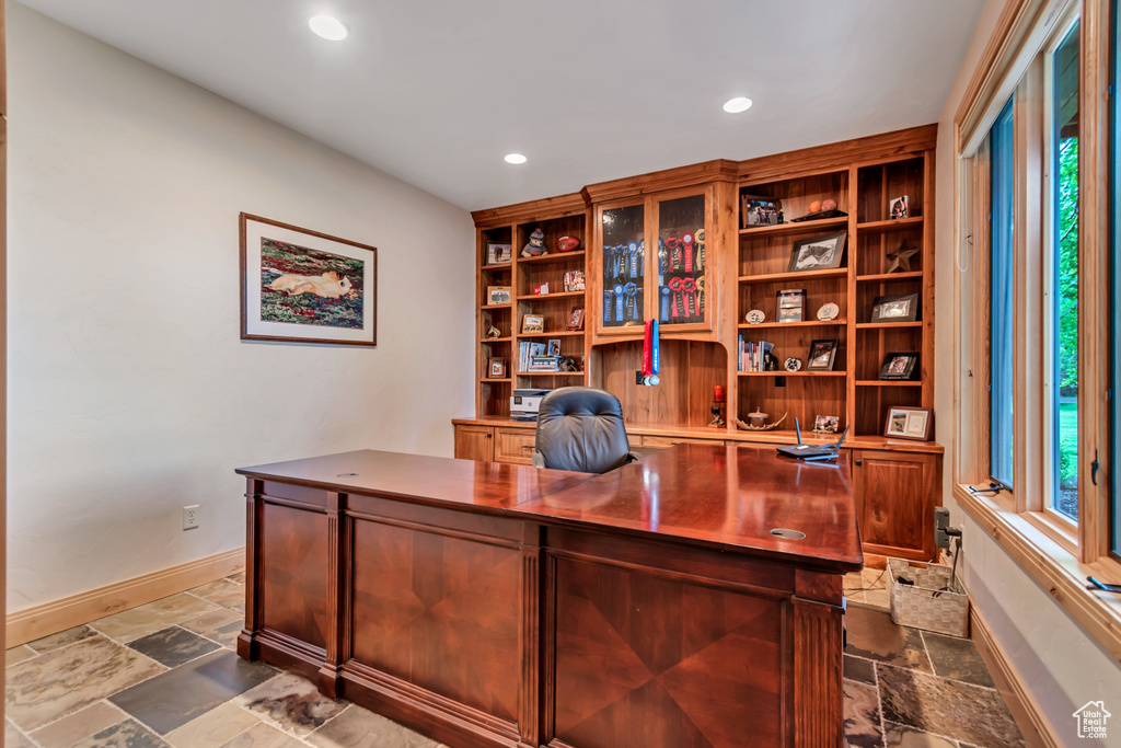 Office area with stone tile floors and recessed lighting
