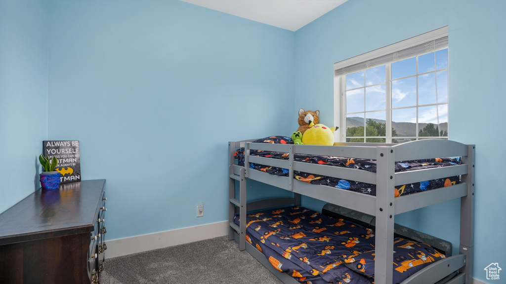 Bedroom with carpet flooring and baseboards