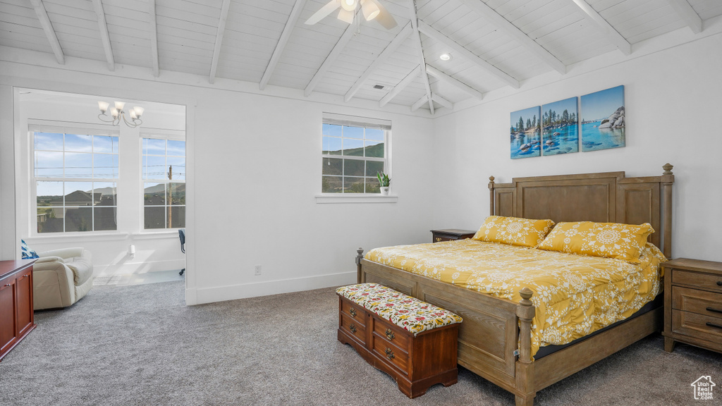 Carpeted bedroom featuring wooden ceiling, a chandelier, and ceiling fan
