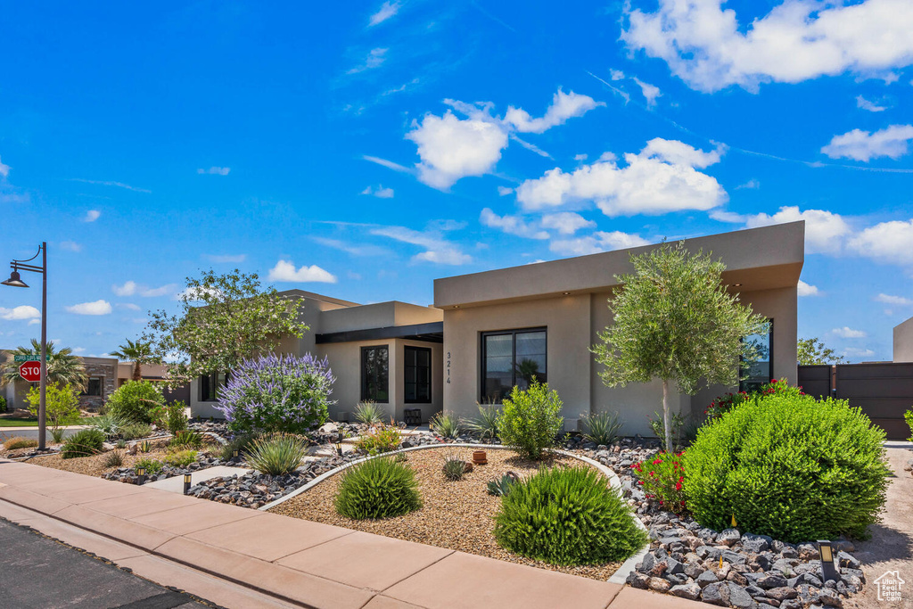 View of front of house featuring stucco siding