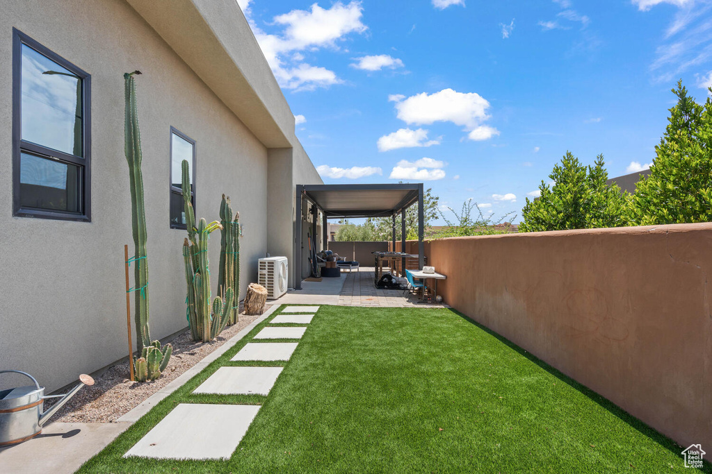 Fenced backyard featuring a patio area