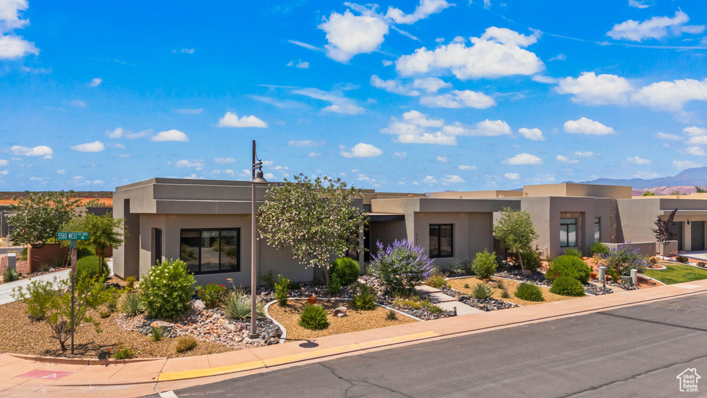 Pueblo revival-style home with stucco siding