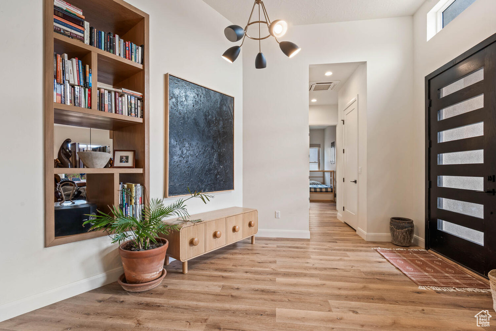 Foyer entrance featuring wood finished floors
