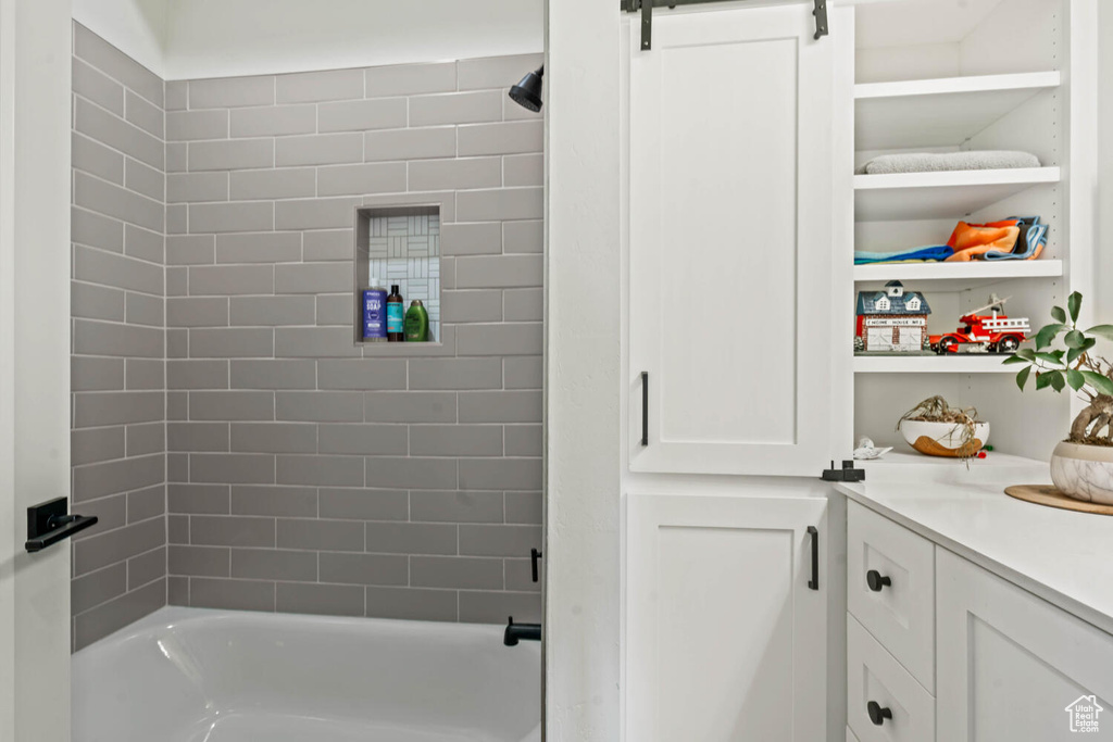 Full bathroom featuring tub / shower combination and vanity