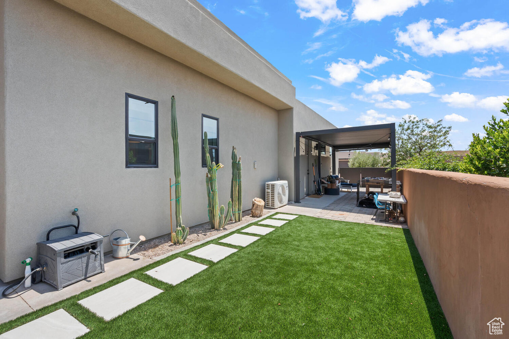 Fenced backyard featuring a patio area