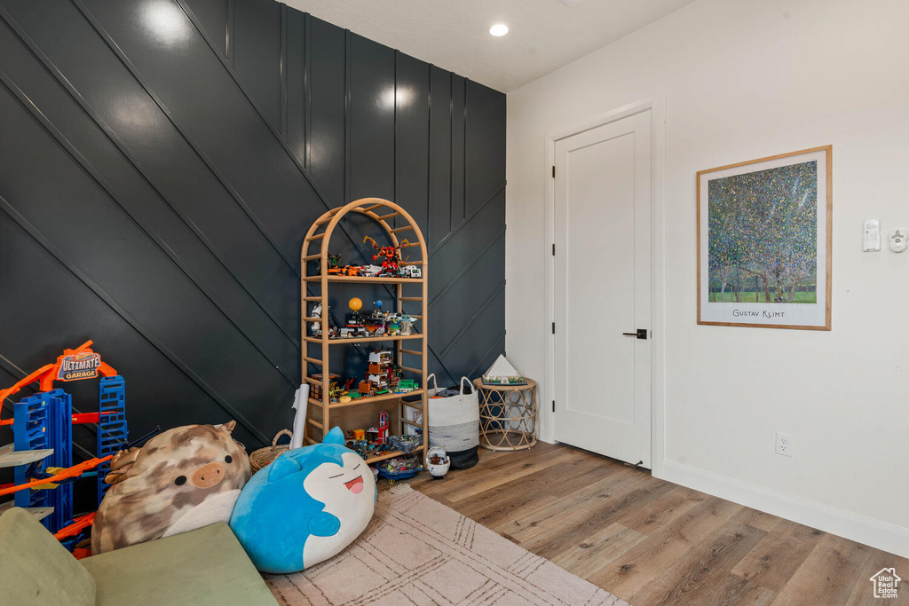 Rec room featuring wood finished floors and recessed lighting