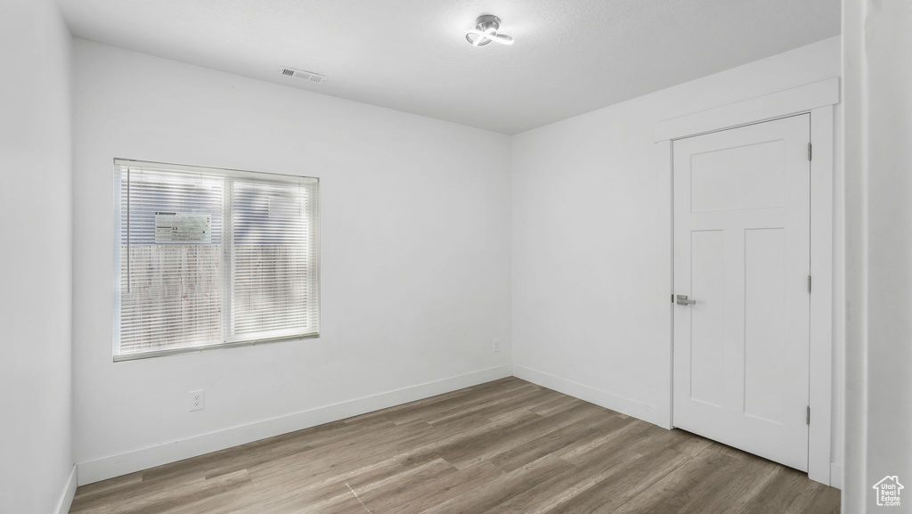 Unfurnished room featuring wood finished floors