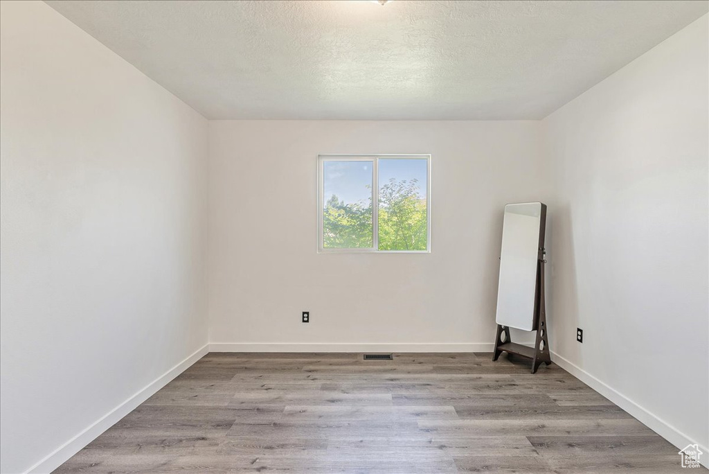 Empty room with wood finished floors