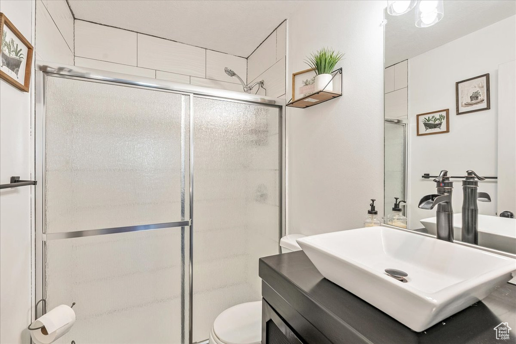 Full bath with vanity and a stall shower