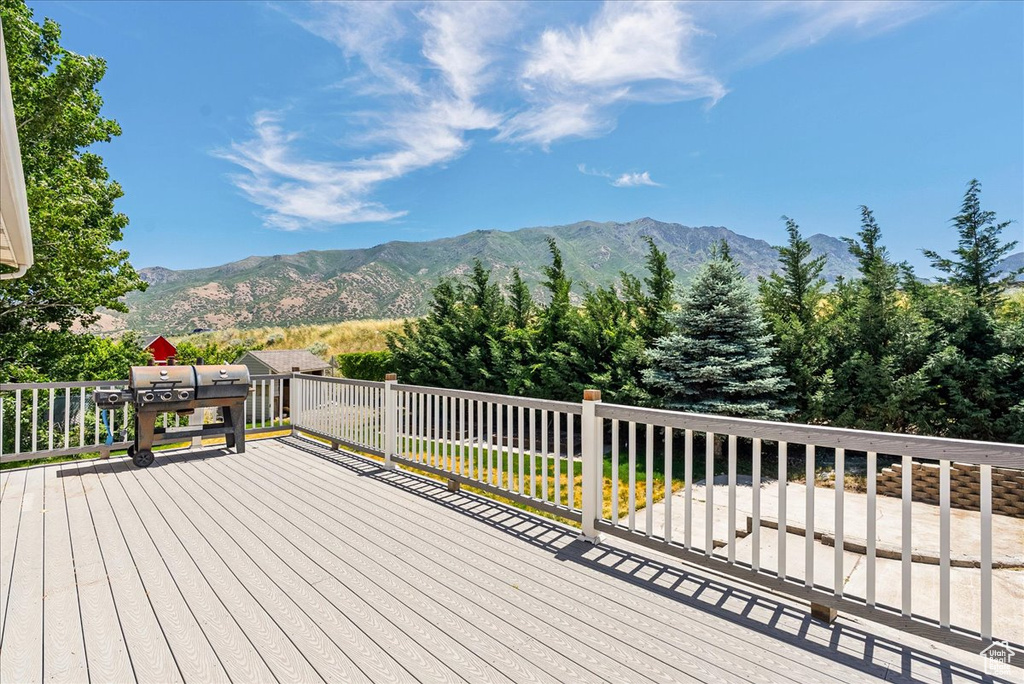 Wooden terrace featuring a mountain view