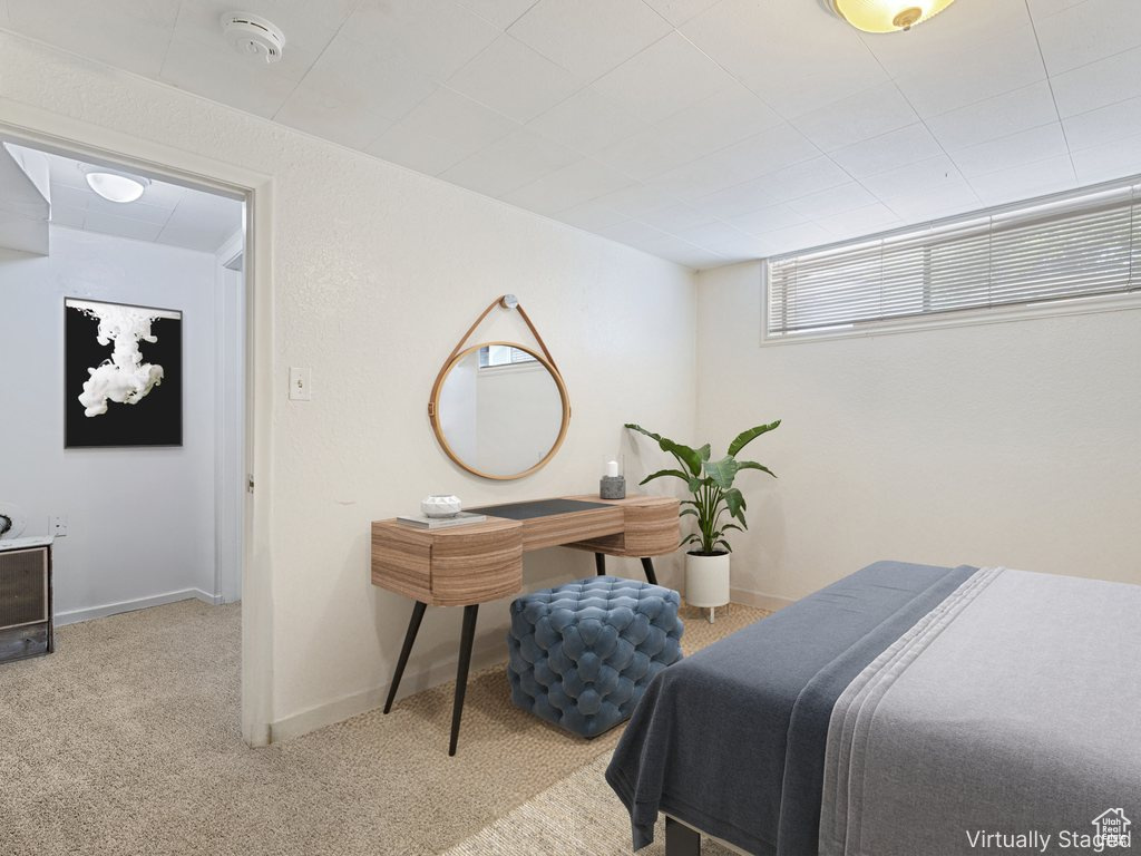 Carpeted bedroom with baseboards