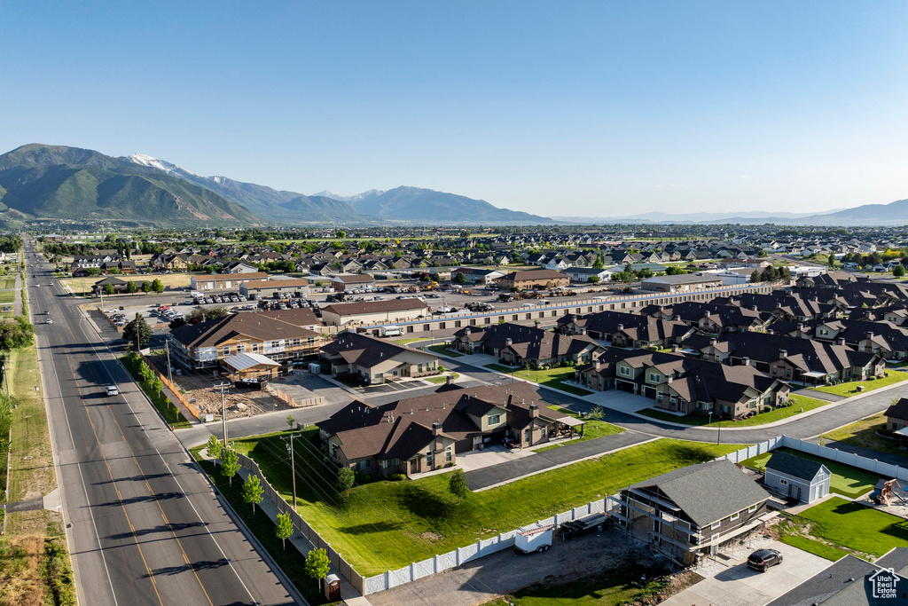 Aerial view of residential area featuring a mountain backdrop