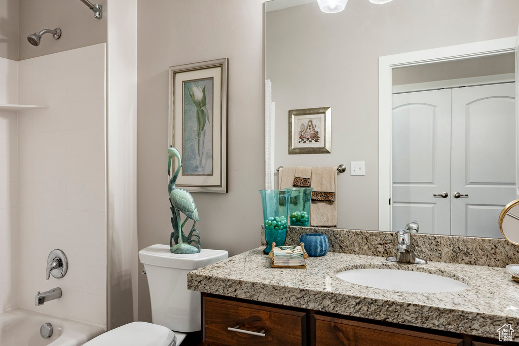 Bathroom featuring vanity and shower / bath combo