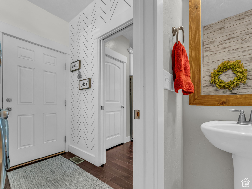 Bathroom with wood finished floors and a sink