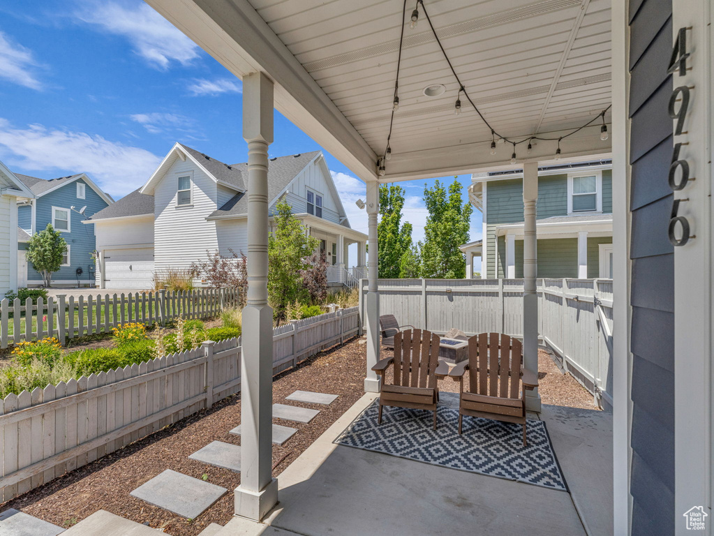 Fenced backyard with a residential view and a patio area