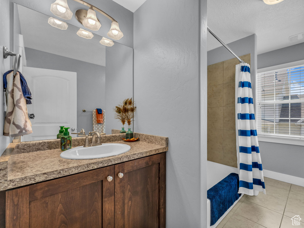 Bathroom featuring vanity and tile patterned flooring