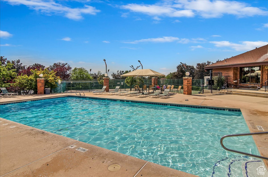 Community pool featuring a patio area
