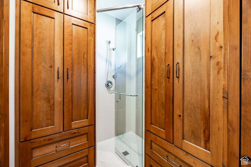Full bath featuring a shower stall