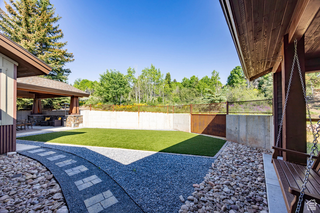 Fenced backyard with a patio area